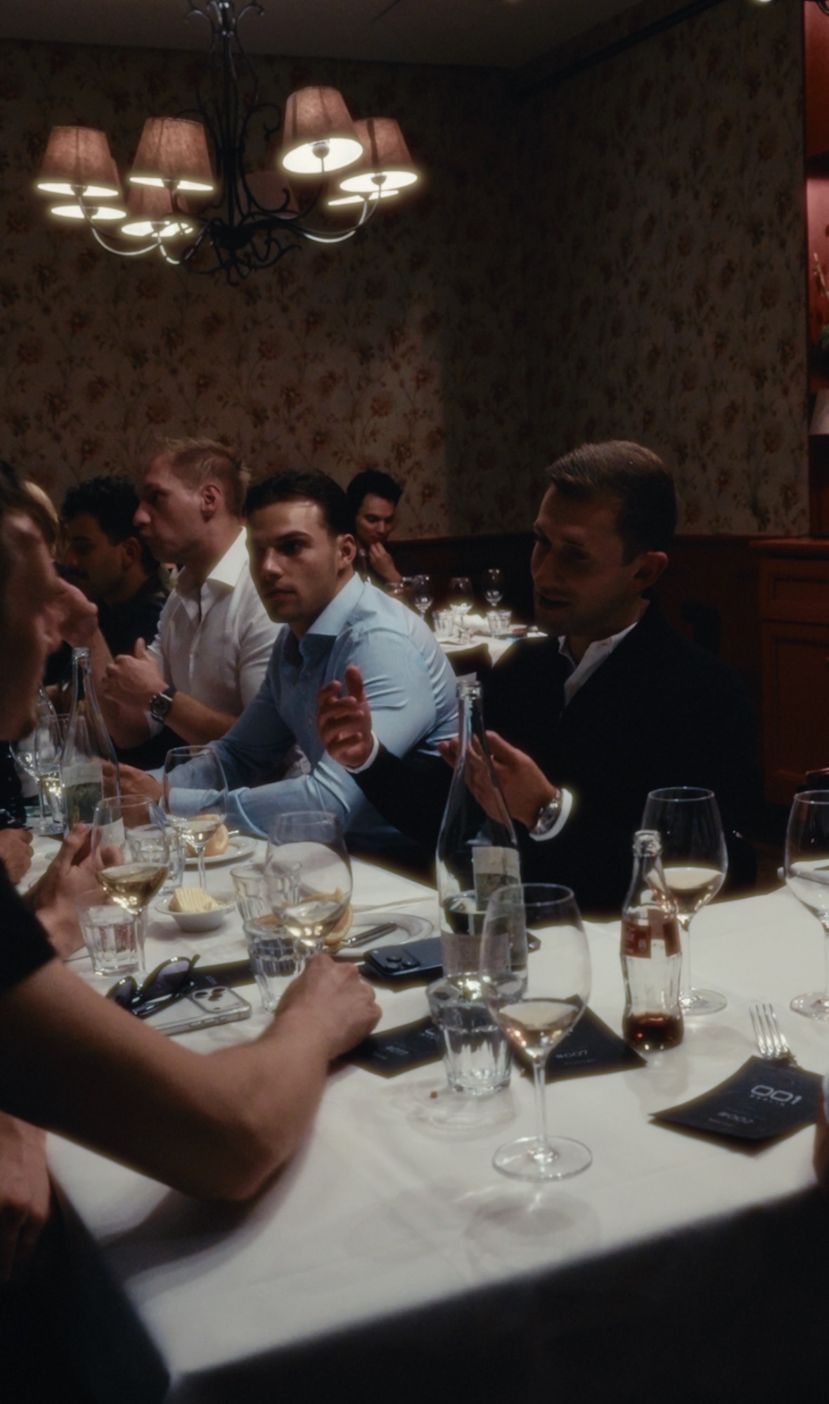 Members in conversation around a long private dinner table